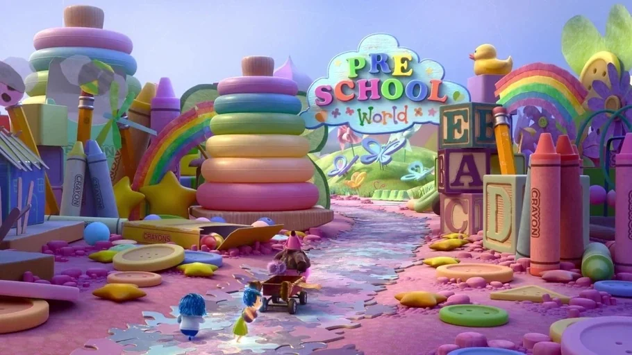 Inside Out (2015) movie still: wide — A whimsical playground constructed from giant colorful toys like crayons, blocks, and rings. Two small…