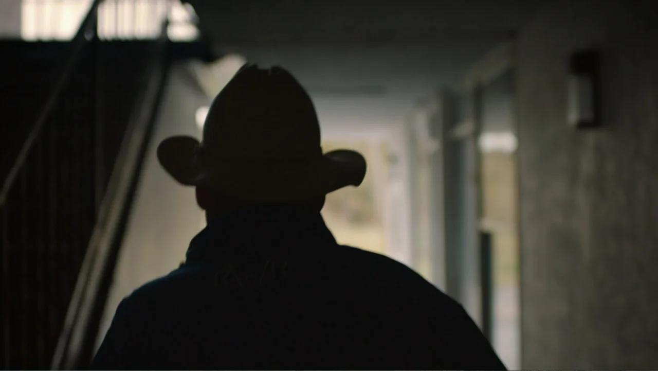Aileen Wuornos : Mind of a Monster (2020) movie still: medium — An outdoor motel walkway features a shaded concrete passage with a prominent…