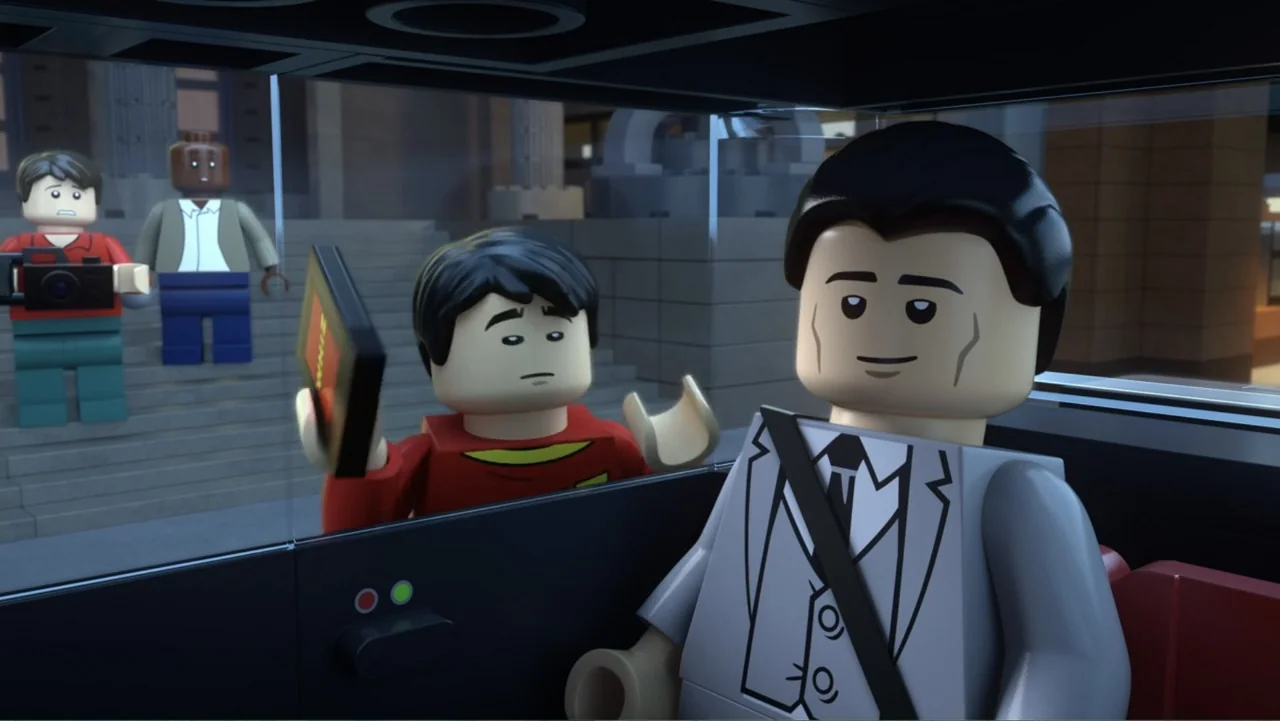 LEGO DC Batman: Family Matters (2019) movie still: medium — A Lego-style character sits inside a vehicle while another person stands outside the…