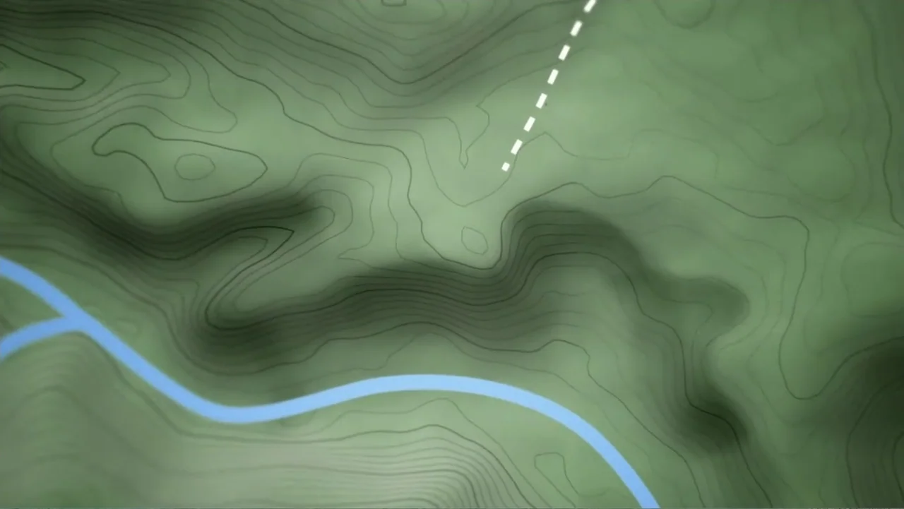 Finding Amelia (2024) movie still: establishing — A digital topographic map displays green terrain with contour lines and a blue road. A white…
