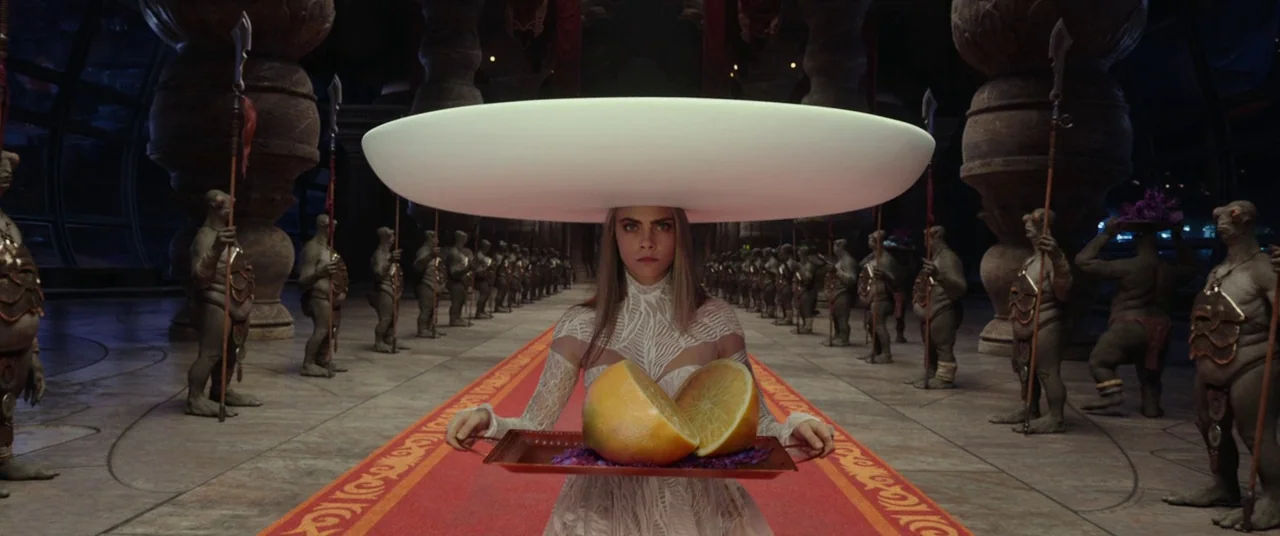 Valerian and the City of a Thousand Planets (2017) movie still: medium — A grand hall features a long red carpet flanked by rows of alien sentinels.…