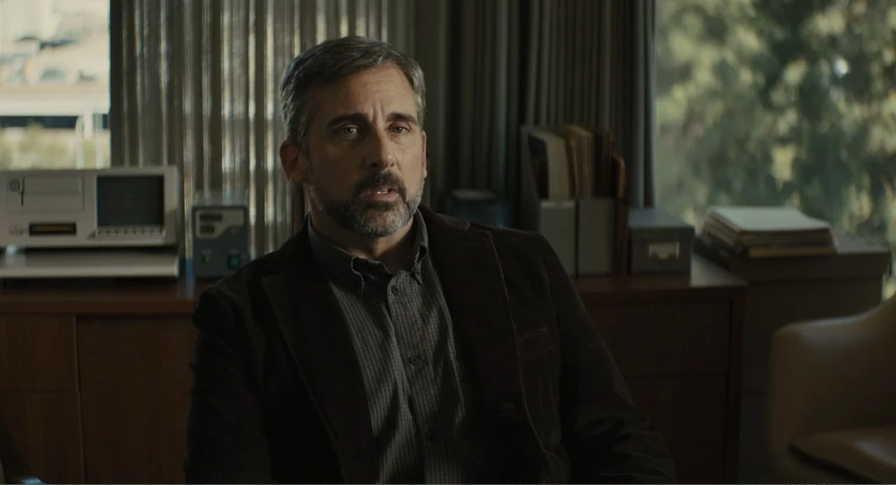 Beautiful Boy (2011) movie still: medium — An office interior features wooden furniture, a vintage computer, and stacked document files. A…