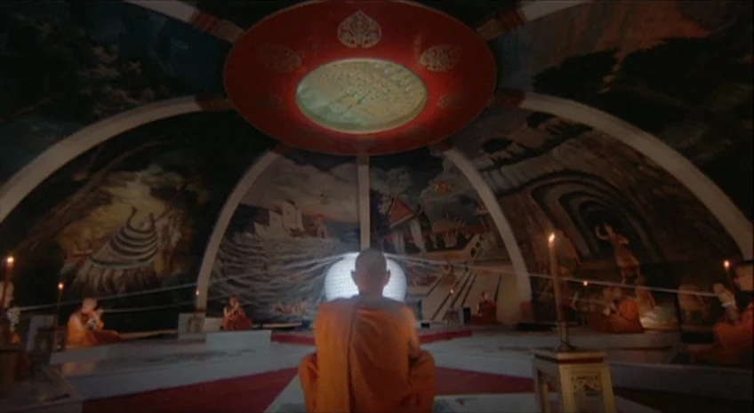 Boxer’s Omen (Mo) (1983) movie still: wide — A circular dome interior features elaborate religious murals and a large central glowing sphere. A…