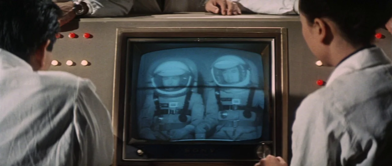 Invasion of Astro Monster (1965) movie still: medium — A technical monitoring area with a gray console housing a Sony cathode ray tube monitor. Two…