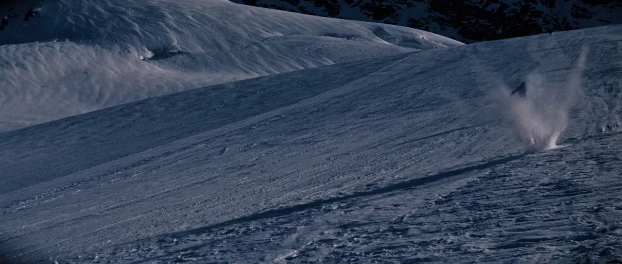 On Her Majesty’s Secret Service (1969) movie still: wide — A vast, expansive snow-covered mountainside features rolling hills and deep, cast…