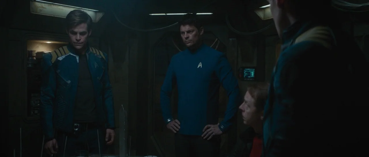 Star Trek Beyond (2016) movie still: medium — A dark, technological environment with panelled bulkheads and soft, integrated overhead lighting…