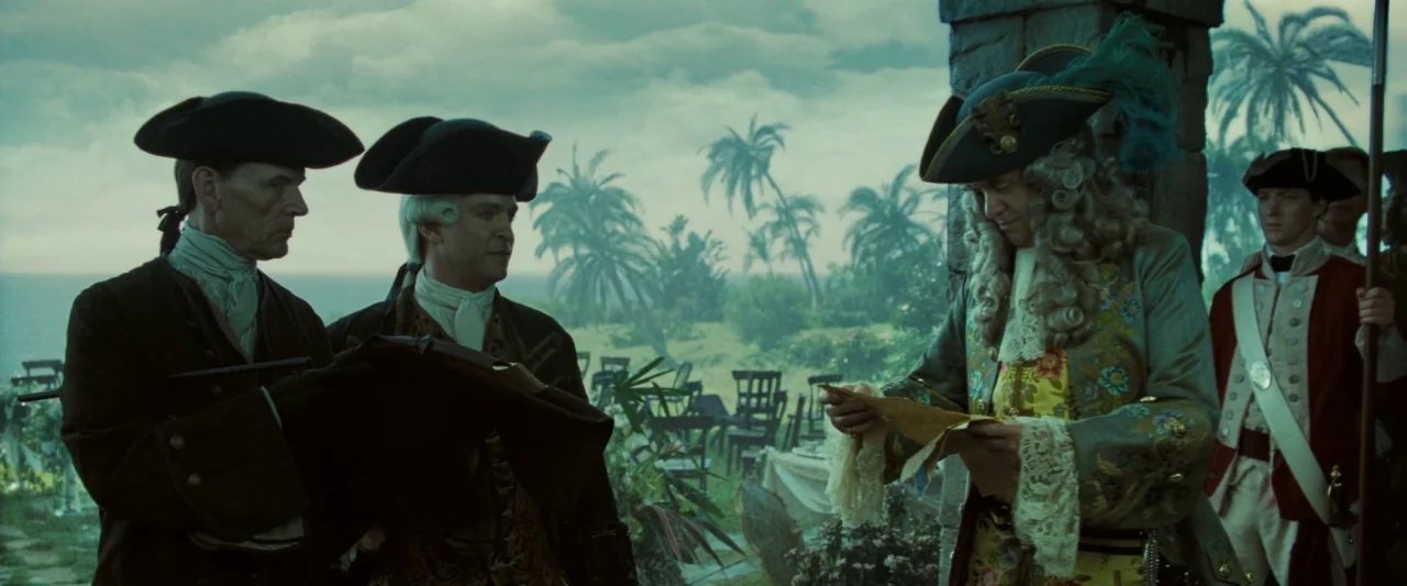 Pirates of the Caribbean: Dead Man’s Chest movie still: medium — An open stone terrace overlooks a misty tropical landscape with numerous palm…