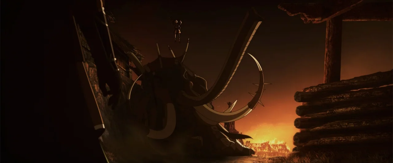The Lord of the Rings: The War of the Rohirrim (2024) movie still: wide — A nighttime encampment features wooden structures illuminated by a large,…