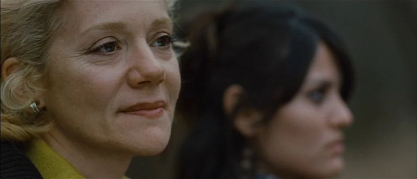 The Headless Woman (2008) movie still: closeup — A blonde woman in the foreground is in sharp focus, face directed slightly right. A second…