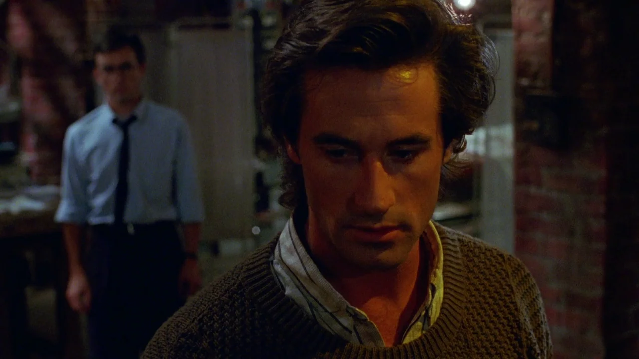 Bride of Reanimator (1989) movie still: medium — An industrial-style interior features exposed brick walls and low-intensity lighting throughout the…