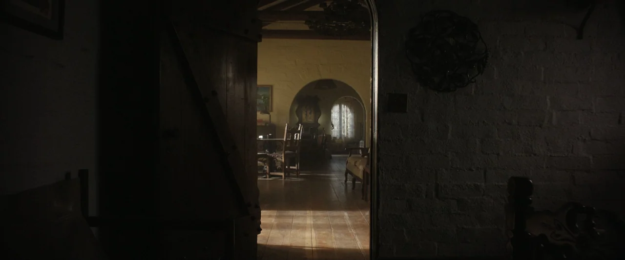 True Account: Breaking the Truce (Yakuza Bloody Chronicles 2) (2007) movie still: wide — A rustic interior with whitewashed brick walls and an open…