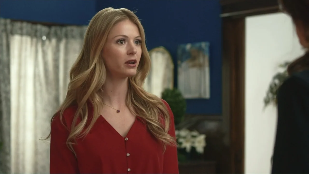 Driving Madeleine (2022) movie still: medium — A residential interior features dark blue walls, patterned curtains, and a white doorway frame. A…