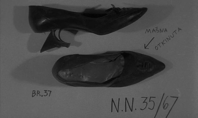 Love Affair, or the Case of the Missing Switchboard Operator (1967) movie still: closeup — Two black leather high-heeled shoes lie on a plain gray…