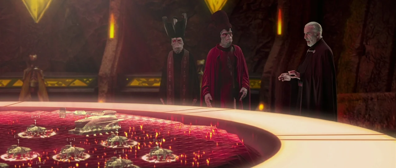 Star Wars: Episode II – Attack of the Clones (2002) movie still: medium — A dark subterranean chamber features carved stone walls and a glowing red…