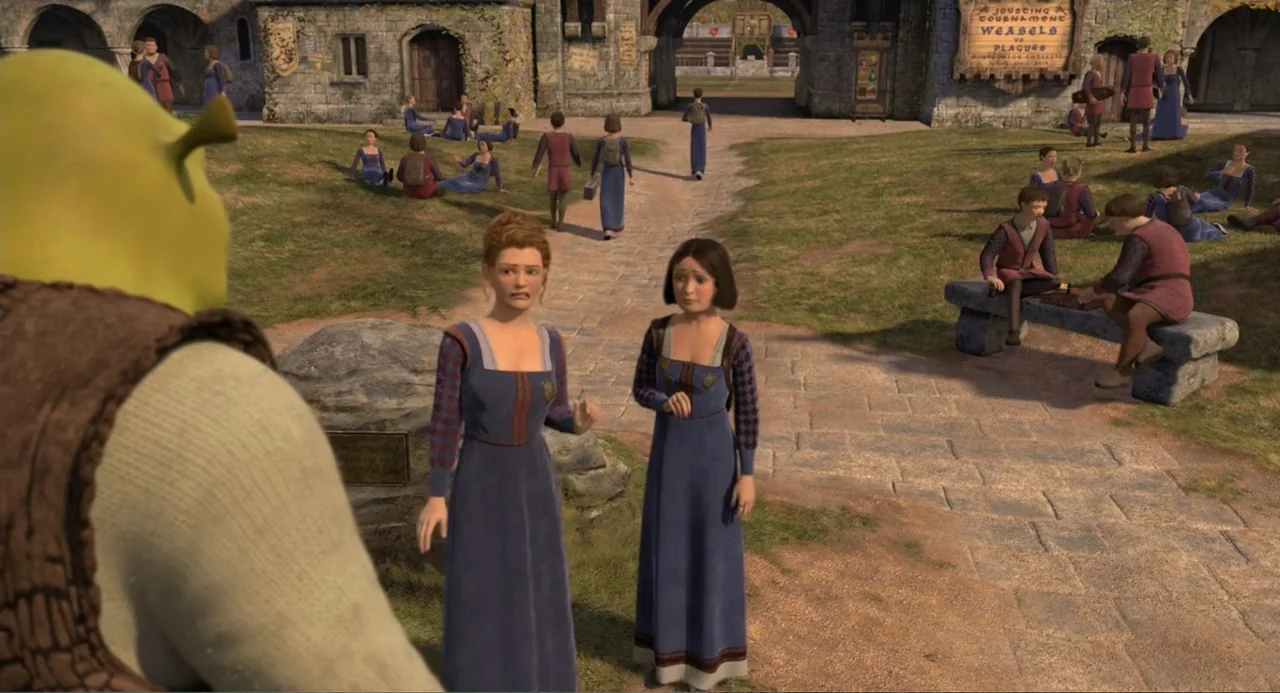 Shrek the Third (2007) movie still: medium — A stone courtyard with crowds and arched doorways serves as the backdrop. Two women in medieval dresses…