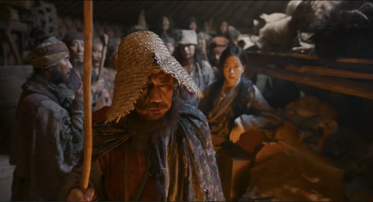 Legends of the Condor Heroes: The Gallants (2025) movie still: medium — A dimly lit interior filled with stacked wooden racks and piles of fabric…