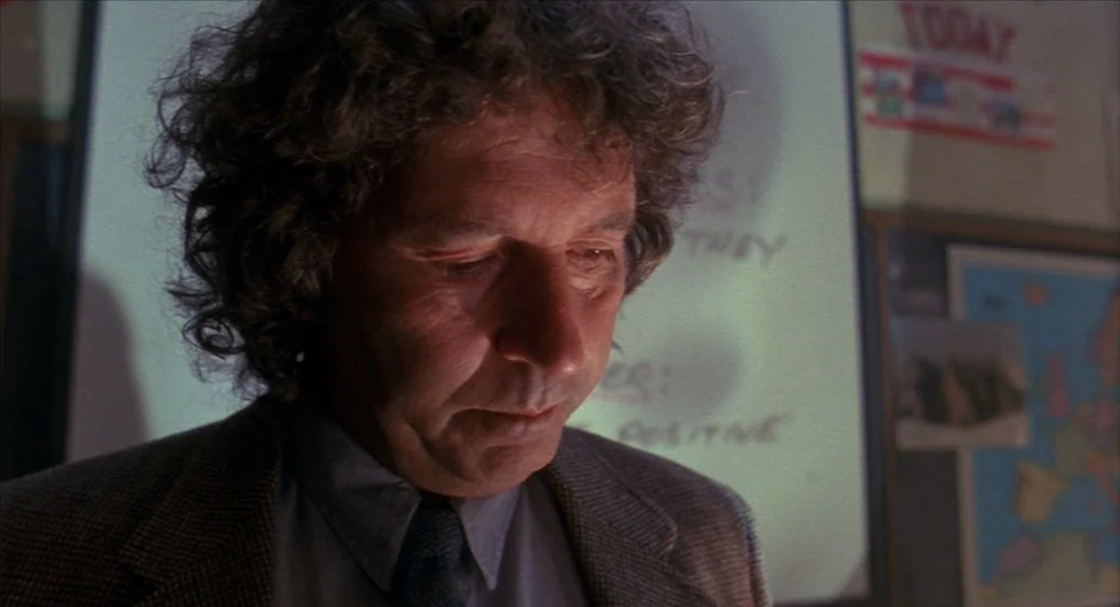 A Nightmare On Elm Street 4: The Dream Master (1988) movie still: closeup — A school classroom interior with a white board and educational posters…
