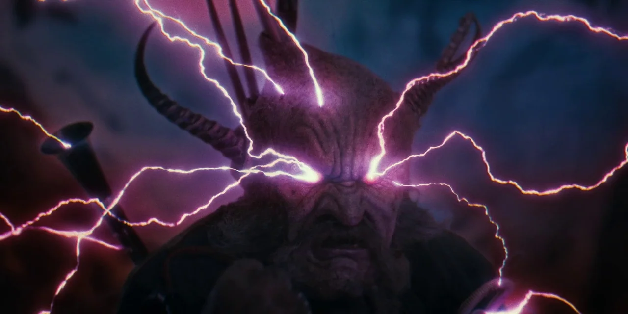 Destroy All Neighbours (2024) movie still: closeup — A craggy, dark environment with mysterious, jagged electrical energy discharging from a horned…