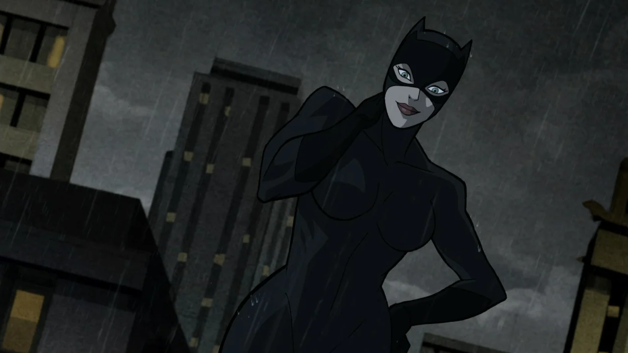 Batman: The Long Halloween, Part One (2021) movie still: medium — A dark urban rooftop at night with tall buildings in the background during rain. A…