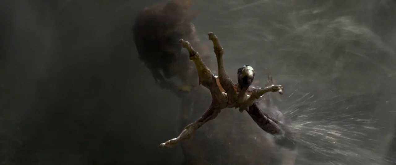 Pirates of the Caribbean: On Stranger Tides movie still: closeup — A pale, thin, bony avian claw reaches forward from beneath dark, turbulent liquid…