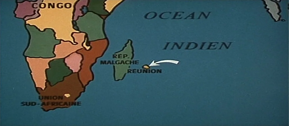 Mississippi Mermaid (1969) movie still: establishing — A flat illustrated map of Southern Africa displays political borders in various muted colors.…