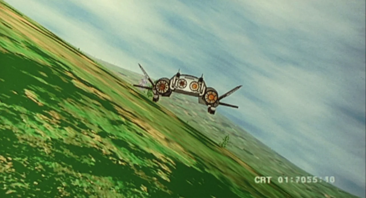 Godzilla vs. Mechagodzilla II (1993) movie still: wide — A futuristic aircraft flies over a vast expanse of green and brown grassy plains. The…