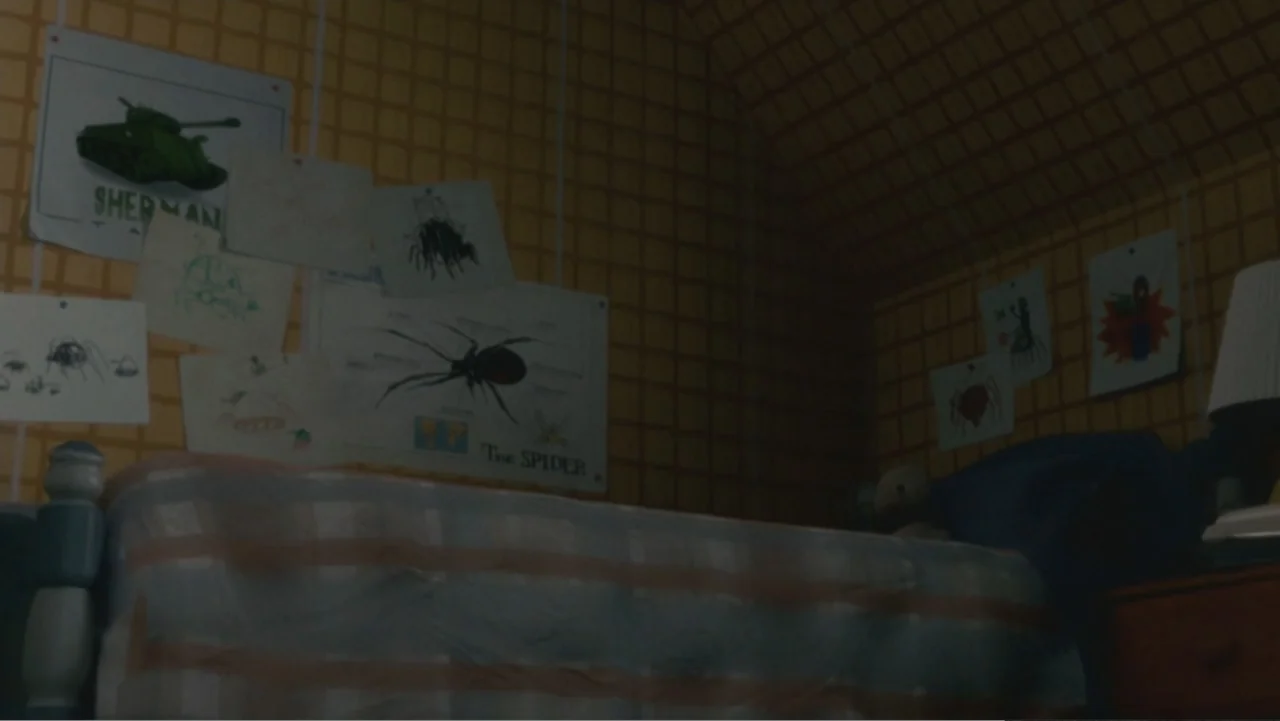 Monster House (2006) movie still: wide — A dimly lit child's bedroom features yellow grid wallpaper covered with pinned hand-drawn illustrations. A…