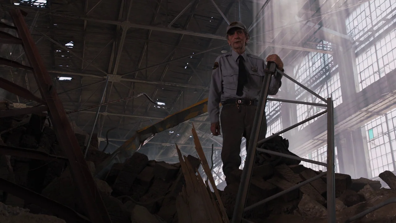 The Avengers (2012) movie still: fullbody — An abandoned, industrial space with high steel ceilings and piles of concrete rubble. An elderly…