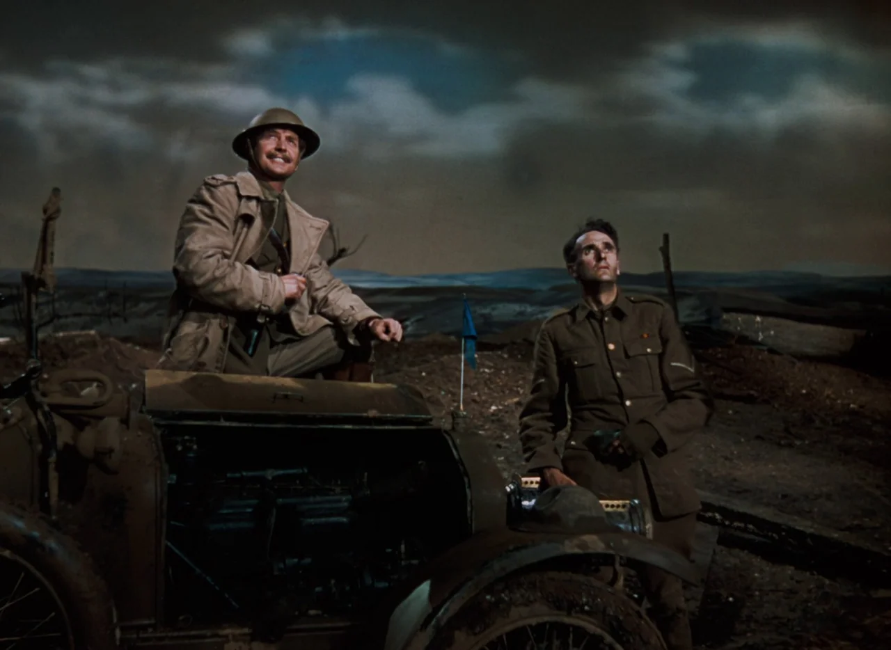 The Life and Death of Colonel Blimp (1943) movie still: fullbody — A desolate, barren landscape at night features two soldiers near a damaged car.…