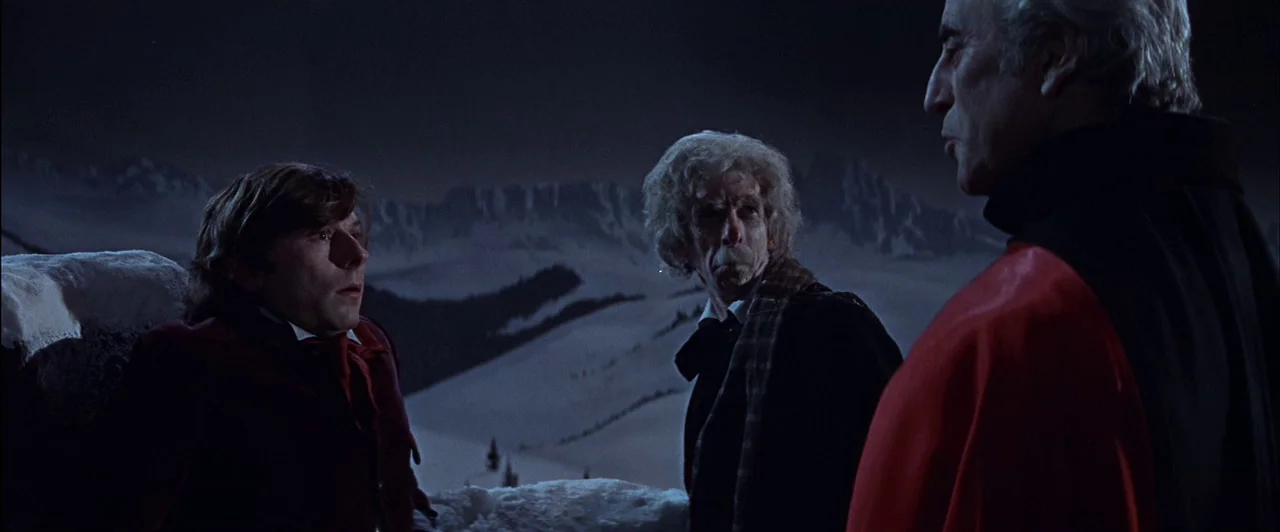 The Fearless Vampire Killers (1967) movie still: medium — Three men stand on a snowy, desolate mountaintop under a dark night sky. They are…