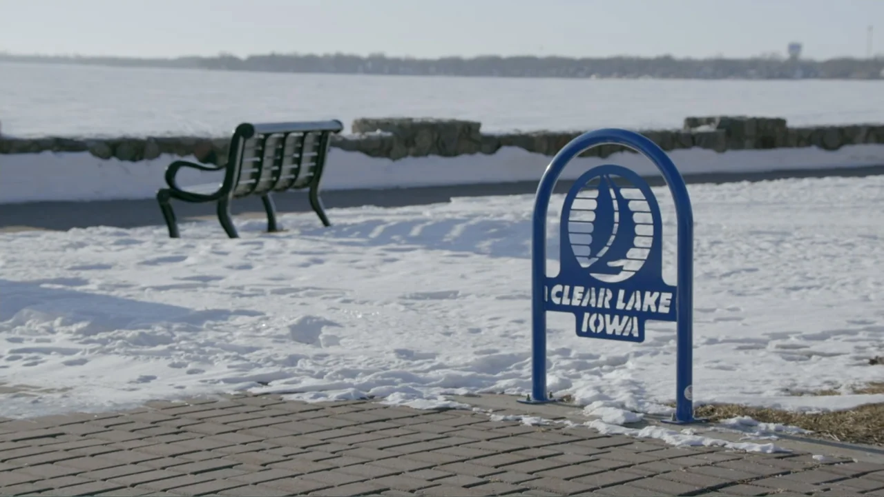The Day the Music Died: The Story of Don McLean's "American Pie" (2022) movie still: wide — A frozen lakeside public area features a brick path and…