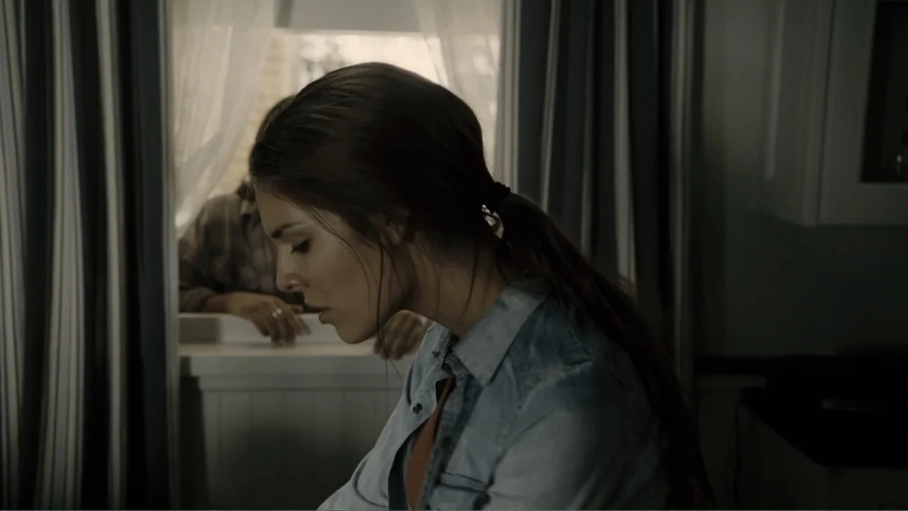 Tomorrow, When the War Began (2010) movie still: medium — A residential kitchen space features a window with white curtains and dark blue stripes. A…