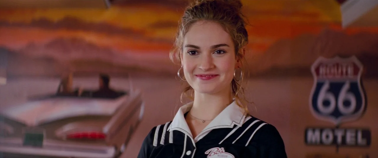 Baby Driver (2017) movie still: medium — A diner interior features a mural of a classic car and a Route 66 sign. A young woman in a waitress uniform…