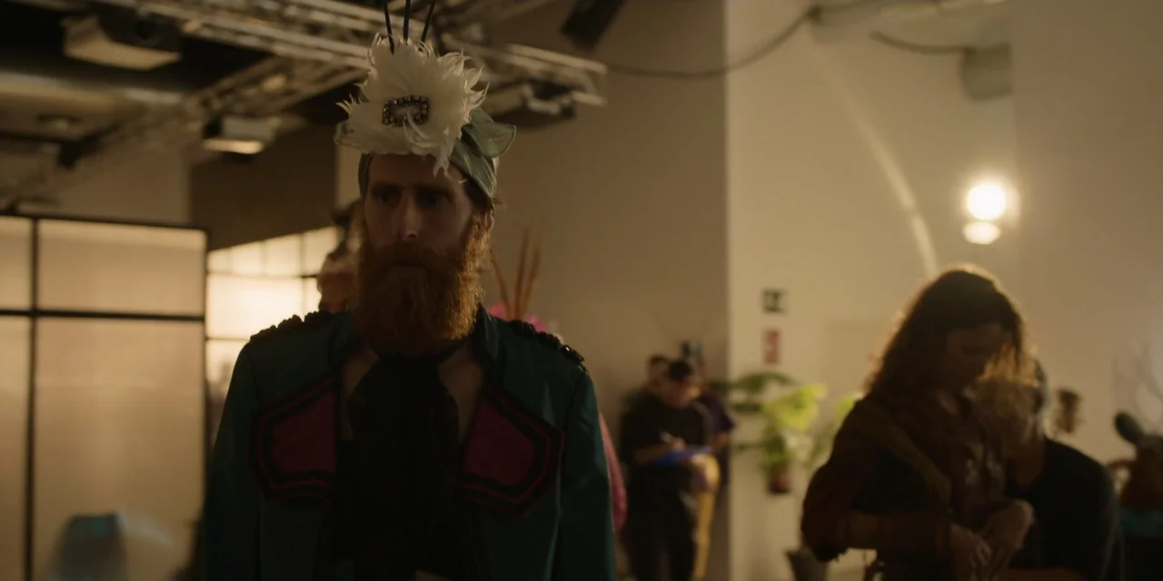 The Three Wise Men: The Truth (2022) movie still: medium — A utilitarian backstage area has exposed industrial ceiling fixtures and white walls. A…