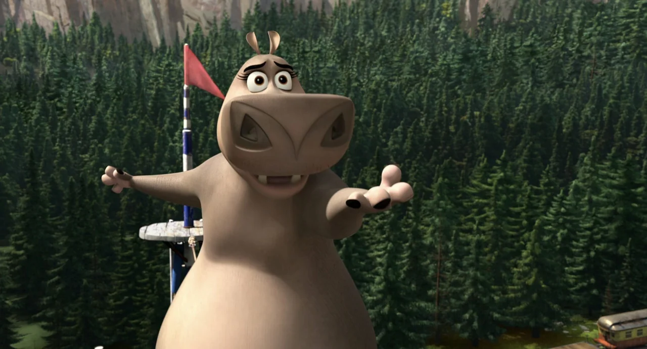 Madagascar 3: Europe's Most Wanted (2012) movie still: medium — A cartoon hippopotamus stands before a dense forest of evergreen pine trees. She…