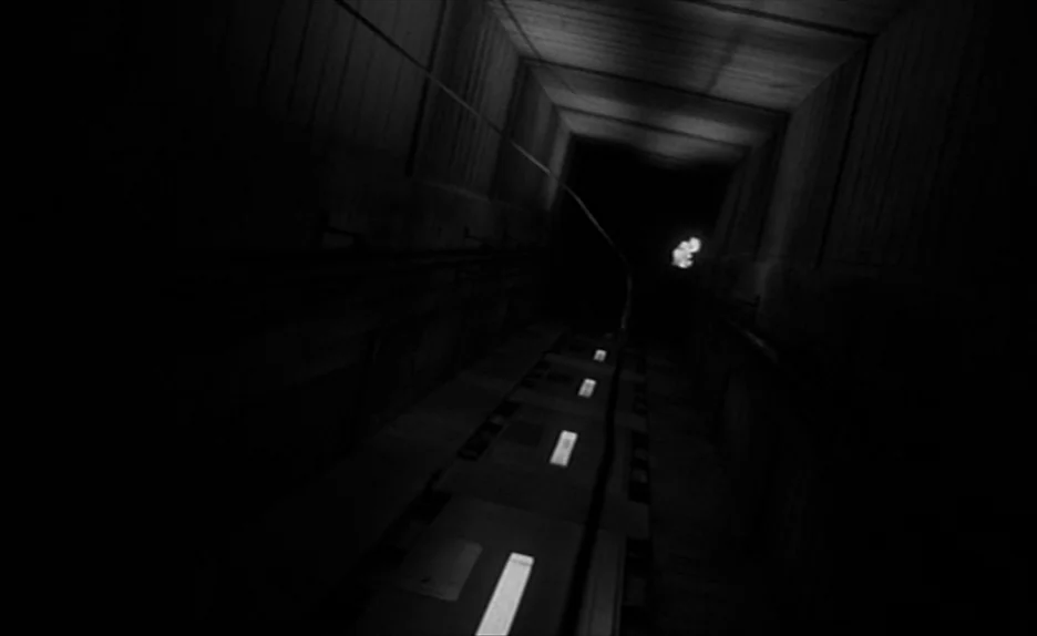 Elevator To The Gallows (Ascenseur pour l’échafaud) (1958) movie still: wide — A dark elevator shaft features concrete walls and a vertical metal…
