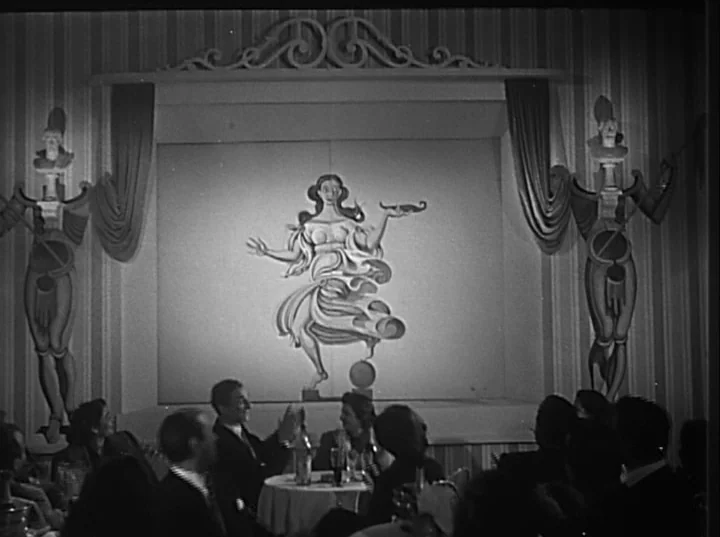 Variety Lights (1950) movie still: wide — A dimly lit nightclub with a large painted female figure centered on the wall. Patrons sit at round tables…