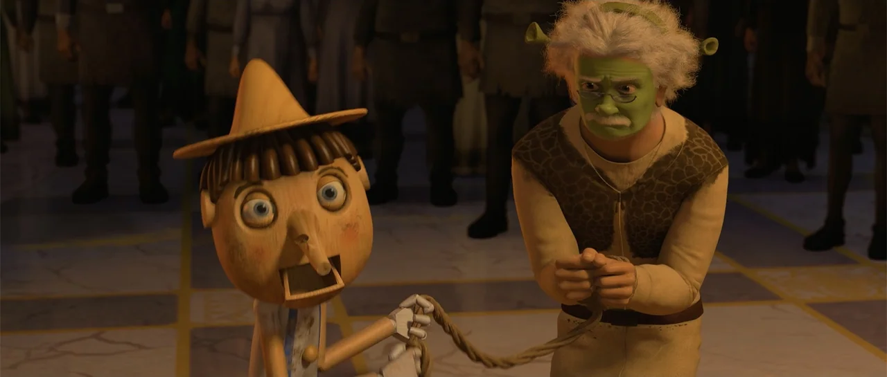 Shrek Forever After (2010) movie still: medium — A stone interior hall with decorative floor tiles serves as the location. A wooden puppet holds a…