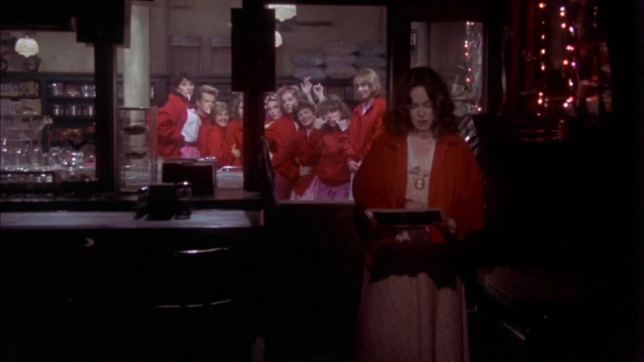 Come Back to the 5 & Dime Jimmy Dean, Jimmy Dean (1982) movie still: medium — A dimly lit diner booth interior features a woman looking at a framed…