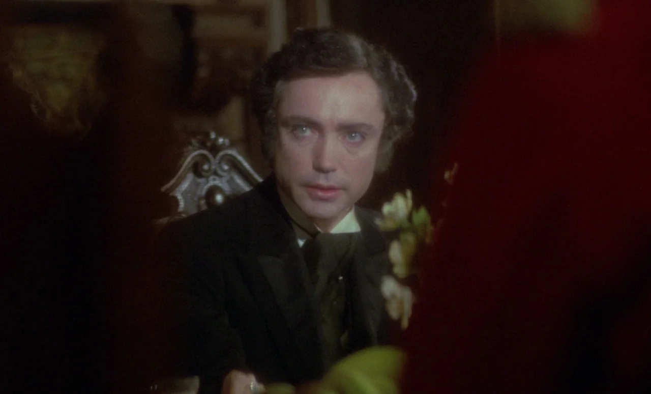 The Strange Case of Dr. Jekyll and Miss Osbourne (1981) movie still: medium — A dimly lit room with ornate wooden furniture and soft evening indoor…