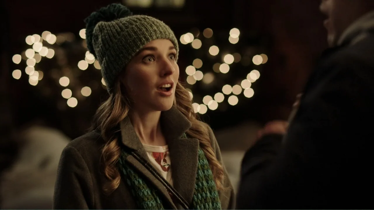 Ghosts of Christmas Past (2021) movie still: medium — A night street scene features a woman standing in front of out-of-focus city lights. The woman…