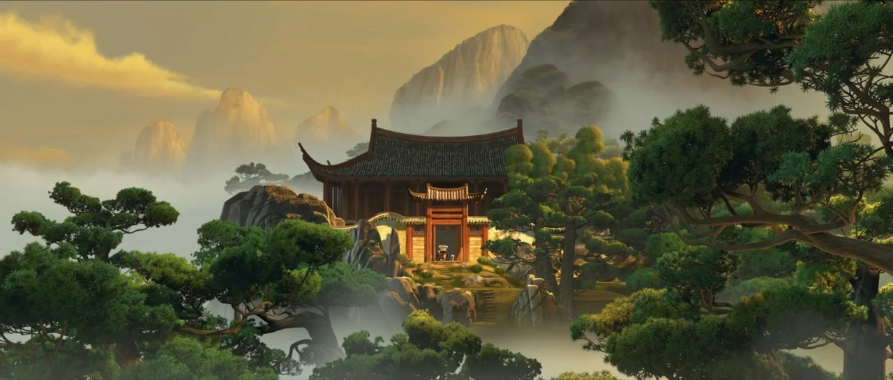 Kung Fu Panda (2008) movie still: establishing — A traditional wooden temple sits atop a rocky crag surrounded by thick, low-hanging mist. Pine…