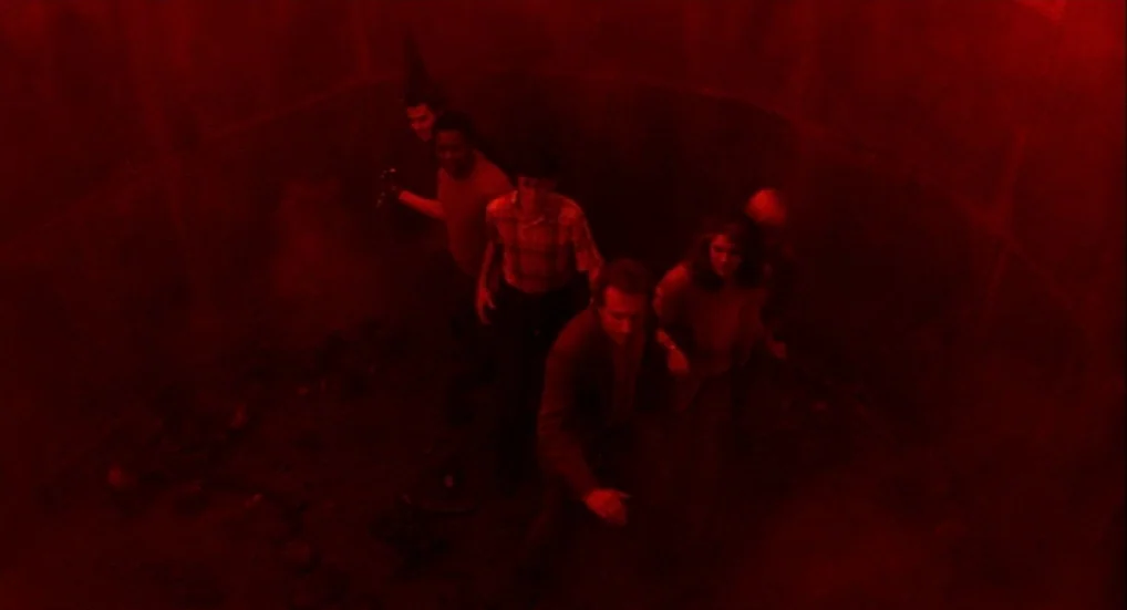 A Nightmare On Elm Street 3: Dream Warriors (1987) movie still: wide — A dark, circular underground space with curved masonry walls. A group of…