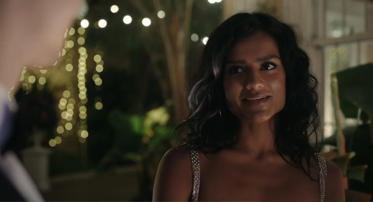 Picture This (2008) movie still: medium — An outdoor evening setting features decorative string lights creating soft bokeh in the background. A…