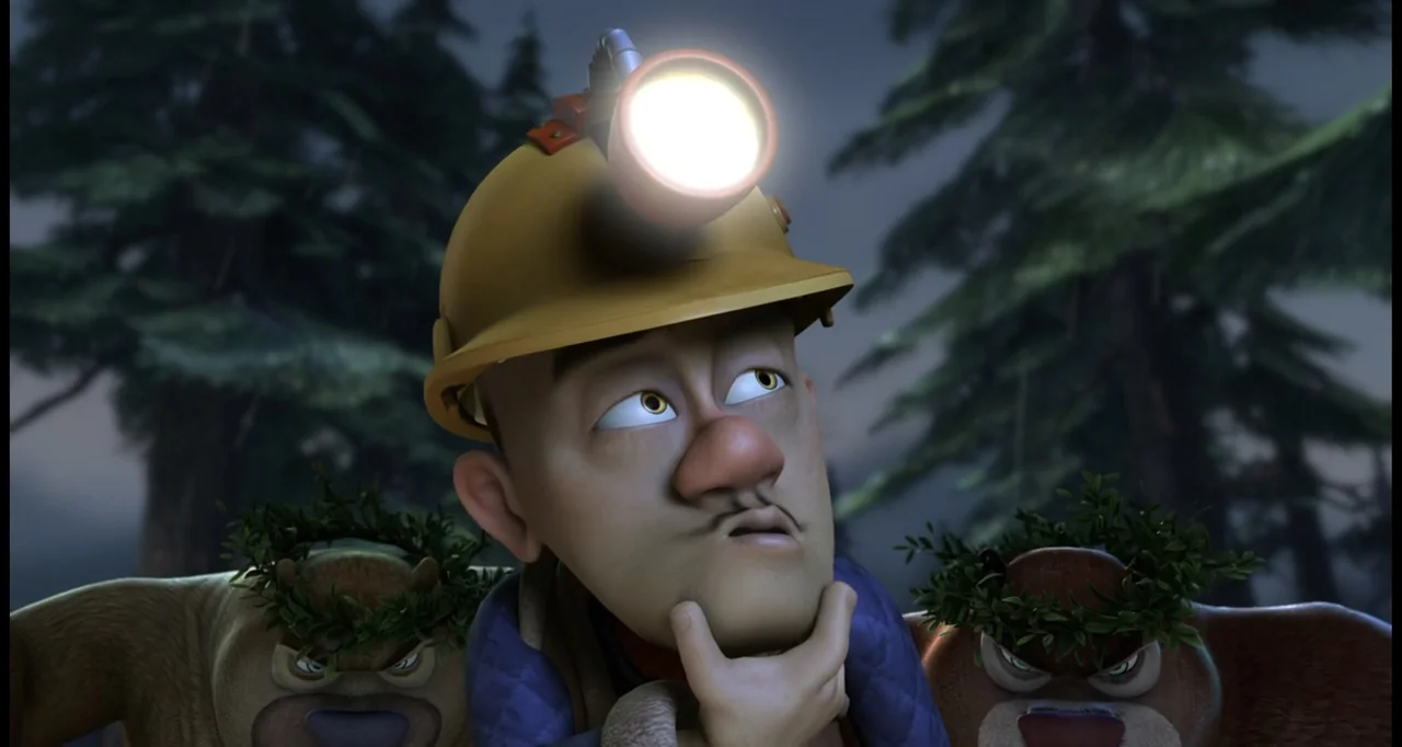 Boonie Bears: To the Rescue (2014) movie still: closeup — A man wearing a hard hat with a lamp stands among two small bears in a dark forest. The…
