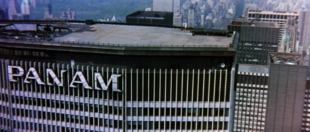 On A Clear Day You Can See Forever (1970) movie still: establishing — An aerial shot shows the Pan Am building roof with a helicopter landing pad.…