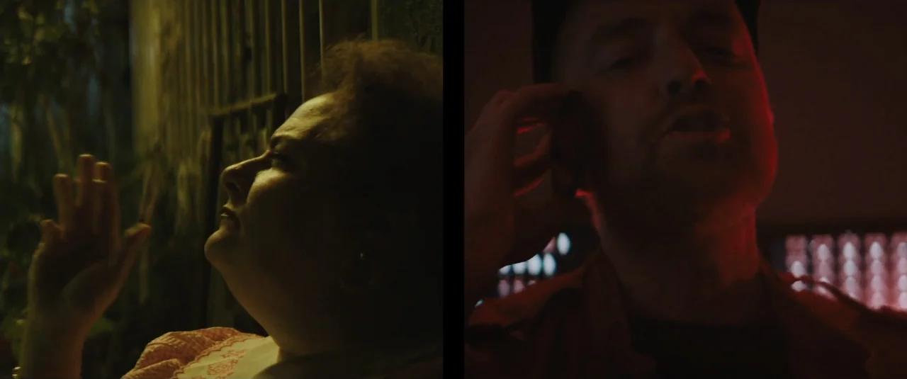 Stalker (2020) movie still: closeup — A split-screen composition shows a dark indoor setting with low-key lighting. On the left a woman is…