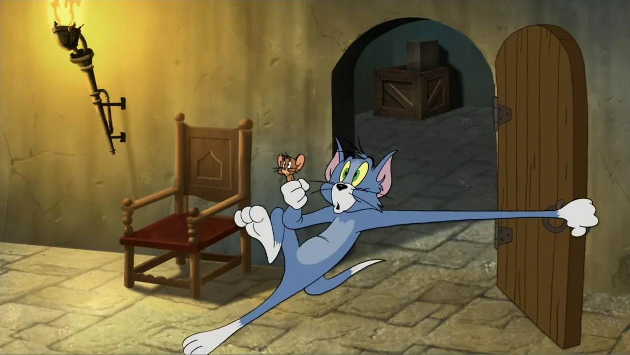 Tom and Jerry & The Wizard of Oz (2011) movie still: medium — A stone corridor with a wooden chair and an open arched doorway at night. A blue…