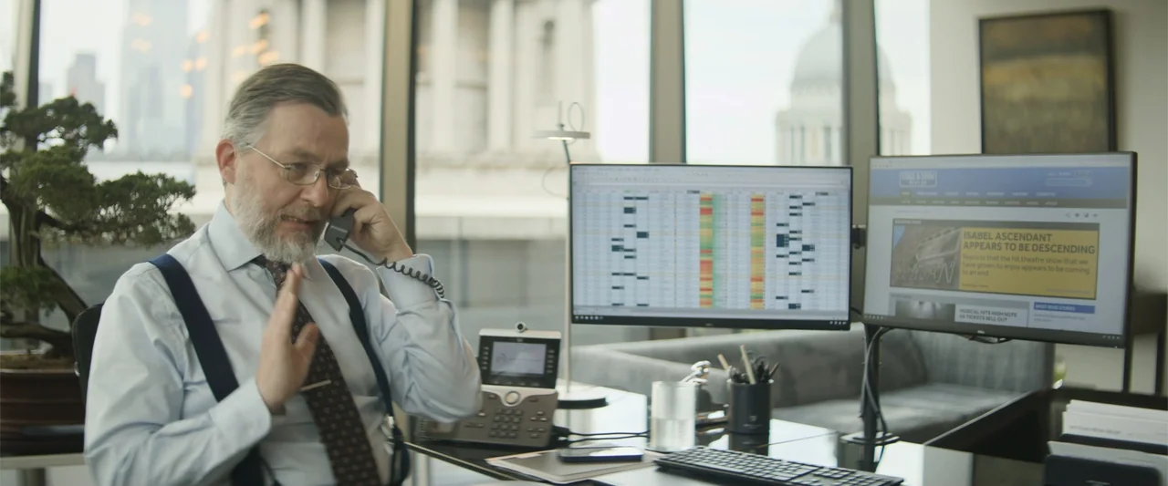Magic Mike's Last Dance (2023) movie still: medium — A modern executive office features a glass desk and large windows overlooking city…