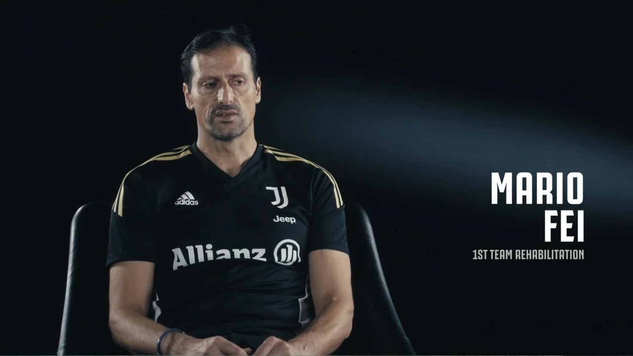 Federico Chiesa - Back on Track (2023) movie still: medium — A man sits centered in a studio with a black background. White text graphic appears on…